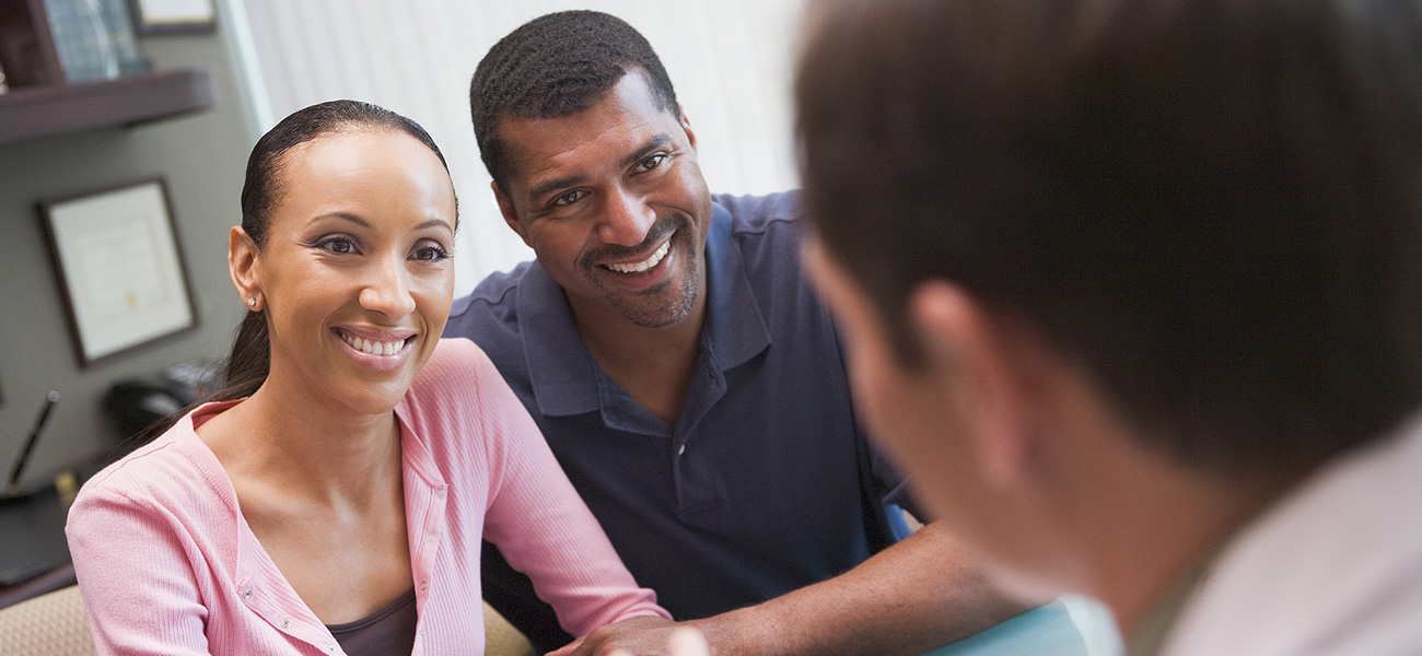 image of couple speaking with a specialist